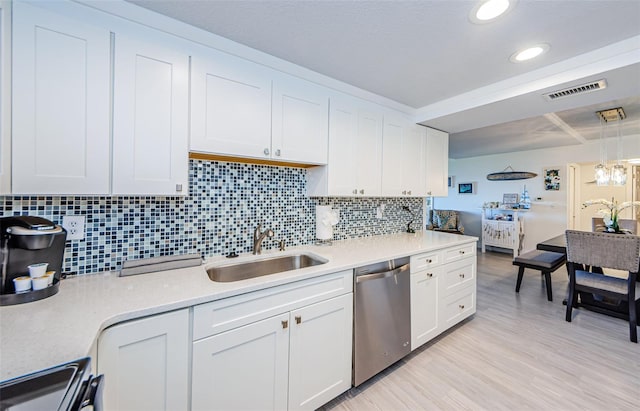 kitchen featuring sink, range, light hardwood / wood-style flooring, dishwasher, and white cabinets