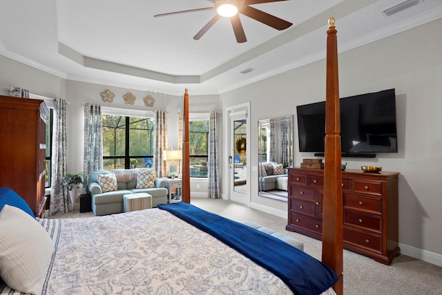 carpeted bedroom featuring access to exterior, crown molding, and a raised ceiling