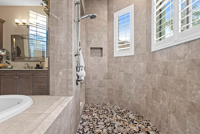 bathroom featuring vanity and a tile shower