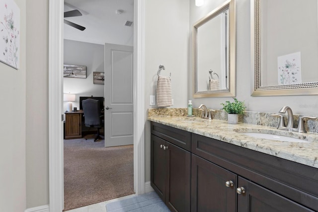 bathroom featuring vanity and ceiling fan