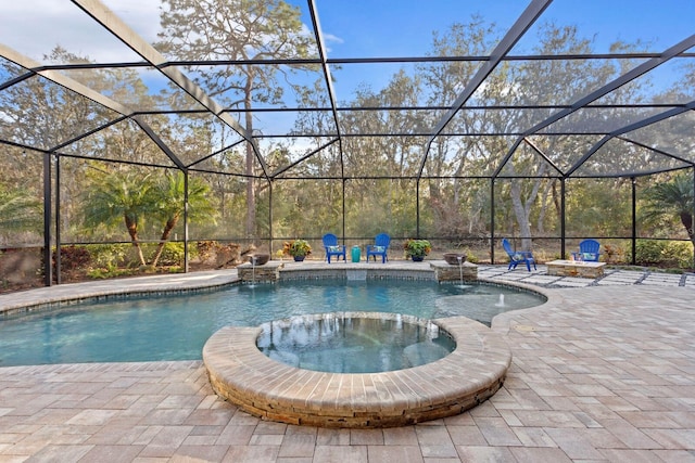 view of swimming pool featuring a lanai, a patio, and an in ground hot tub