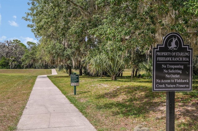 surrounding community featuring a lawn