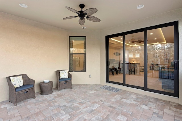 view of patio / terrace featuring ceiling fan