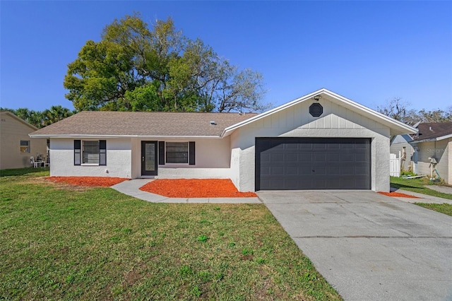 ranch-style house featuring a garage and a front yard