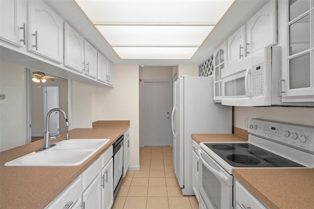 kitchen with sink, white cabinets, light tile patterned floors, ceiling fan, and white appliances