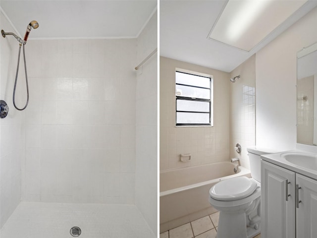 bathroom featuring vanity, tile patterned floors, and toilet