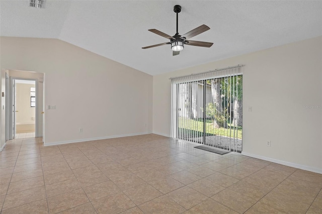 unfurnished room featuring vaulted ceiling, light tile patterned floors, a textured ceiling, and ceiling fan