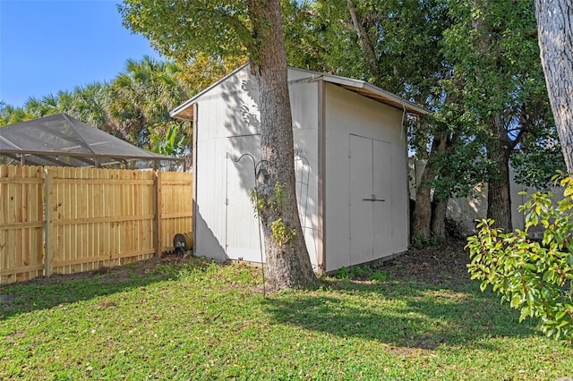 view of outbuilding featuring a yard