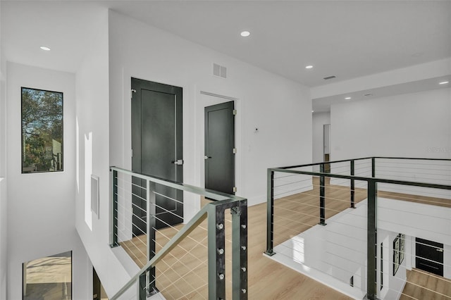 hallway with wood-type flooring