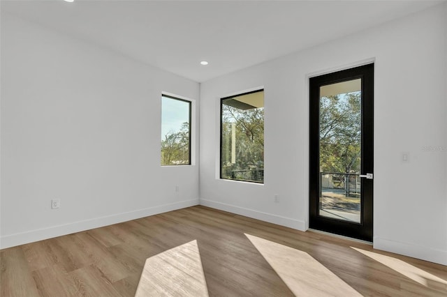 spare room featuring light wood-type flooring