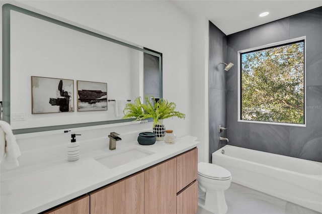 full bathroom featuring a healthy amount of sunlight, toilet, shower / bath combination, and vanity