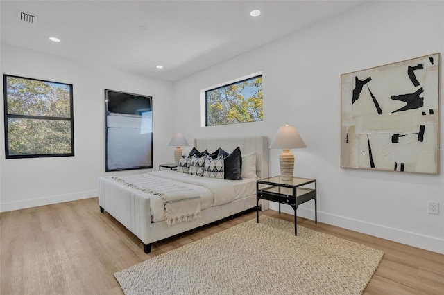 bedroom with light hardwood / wood-style flooring