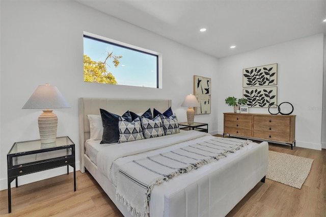 bedroom with hardwood / wood-style flooring