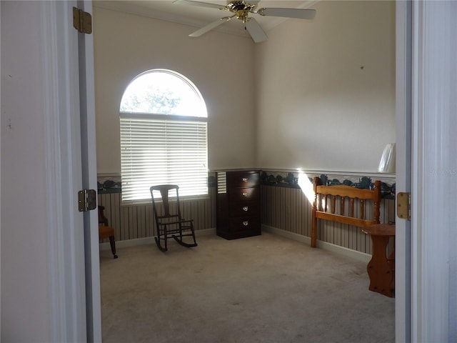 sitting room featuring ceiling fan and light carpet