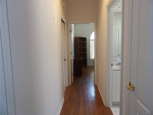 hallway featuring dark hardwood / wood-style floors