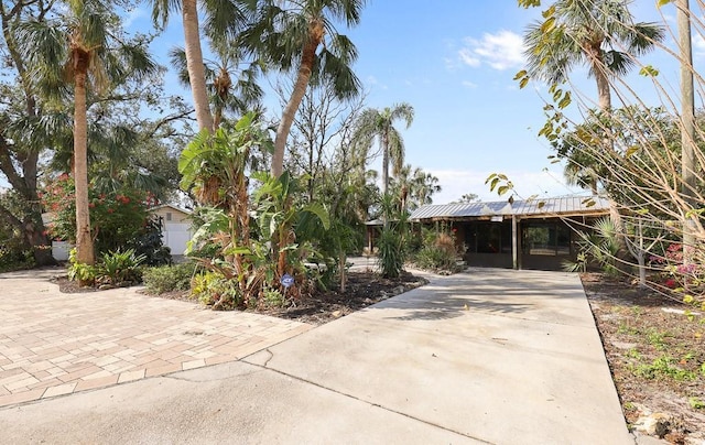 view of front of property featuring a carport