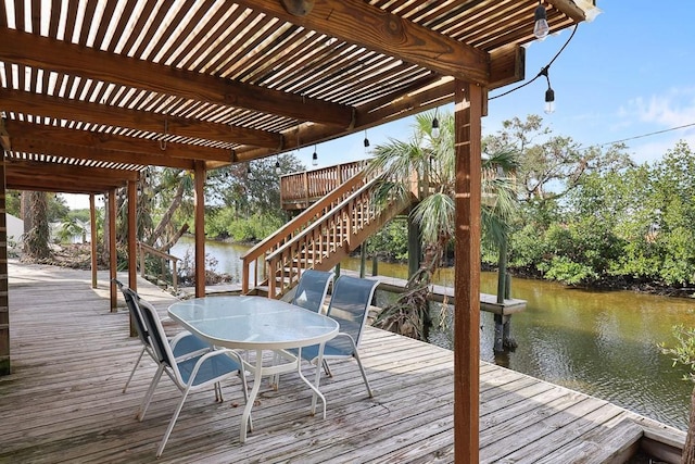 view of dock featuring a water view and a pergola