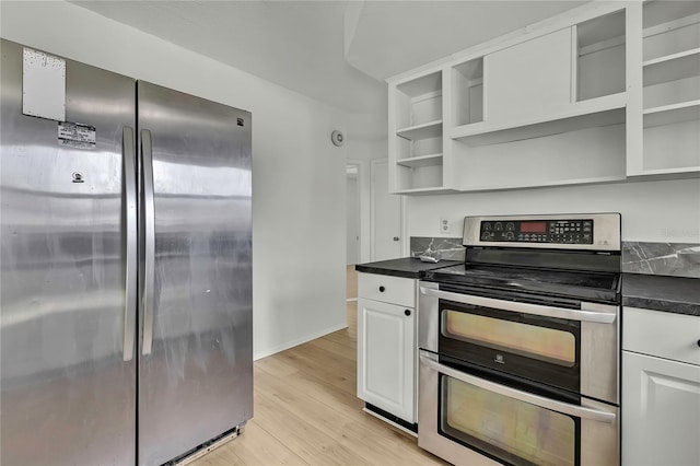 kitchen featuring stainless steel appliances, light hardwood / wood-style floors, and white cabinets