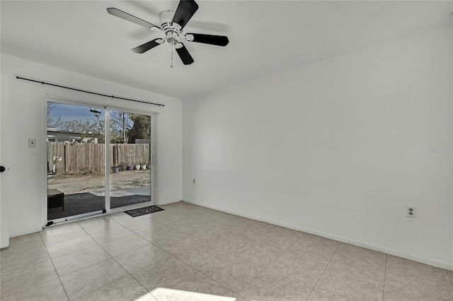 empty room featuring light tile patterned flooring and ceiling fan