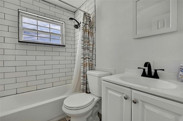 full bathroom with vanity, shower / tub combo, and toilet