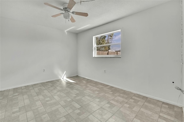 unfurnished room with ceiling fan