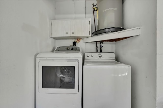 laundry room featuring cabinets and independent washer and dryer