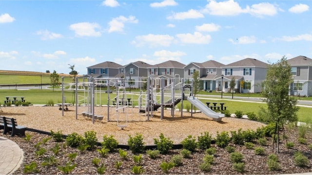 view of playground featuring a lawn