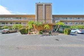 view of property featuring uncovered parking