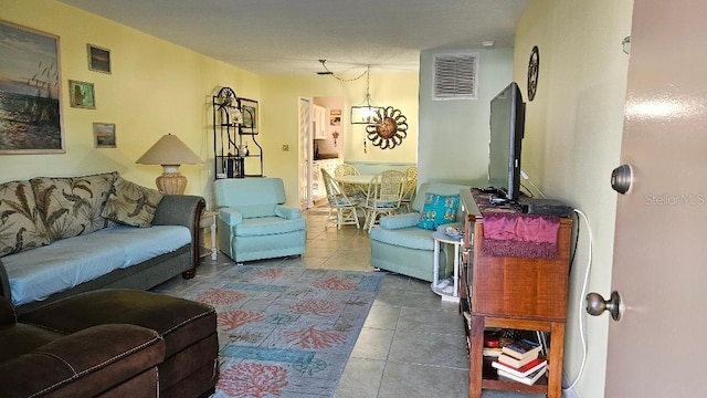 tiled living room featuring visible vents