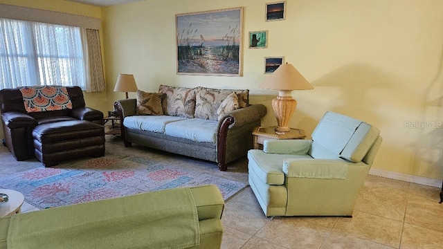 tiled living area with baseboards