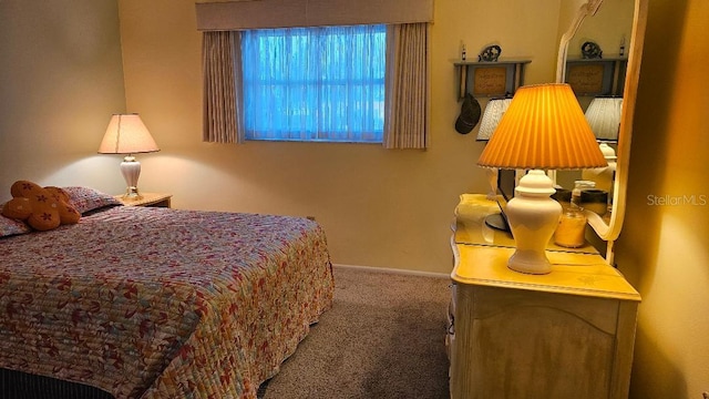 bedroom featuring carpet flooring and baseboards