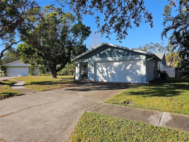 view of front of property with a garage and a front yard