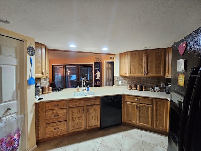 kitchen featuring sink, black appliances, light tile patterned flooring, decorative backsplash, and kitchen peninsula