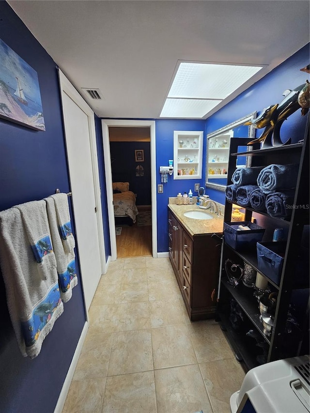 bathroom featuring tile patterned floors and vanity