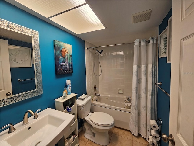 full bathroom featuring shower / tub combo, sink, tile patterned floors, and toilet