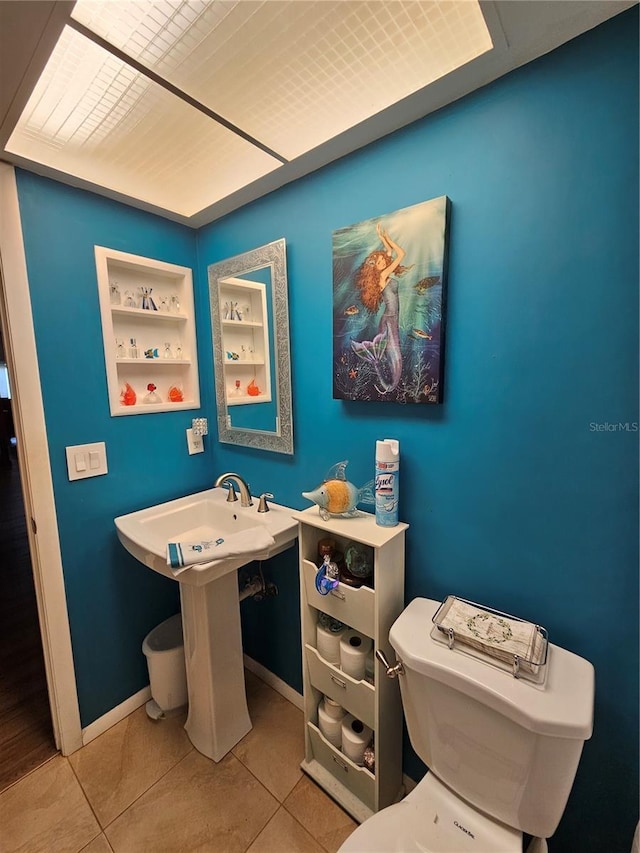 bathroom featuring tile patterned floors and toilet