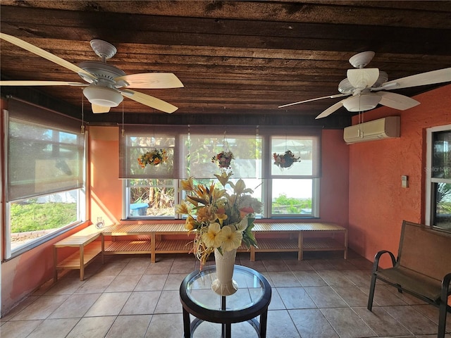 sunroom / solarium featuring a wall unit AC and ceiling fan