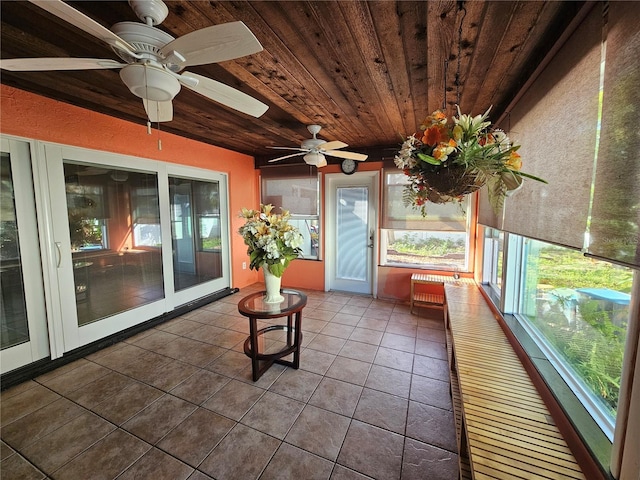 unfurnished sunroom with wood ceiling