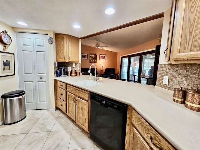 7711 Innis Ct, Saint Petersburg, FL 33709 - kitchen featuring light countertops, a sink, backsplash, a ceiling fan, and dishwasher