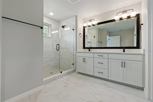 bathroom featuring vanity and a shower with shower door