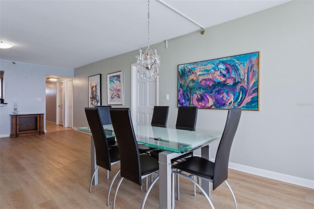 dining space featuring light wood-type flooring