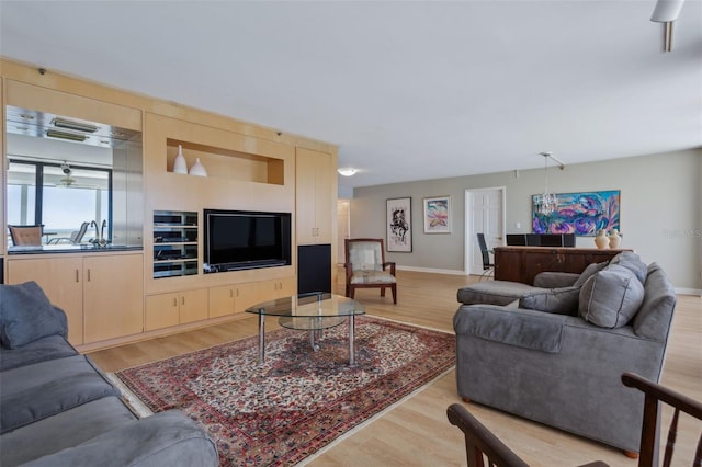 living room with light hardwood / wood-style flooring