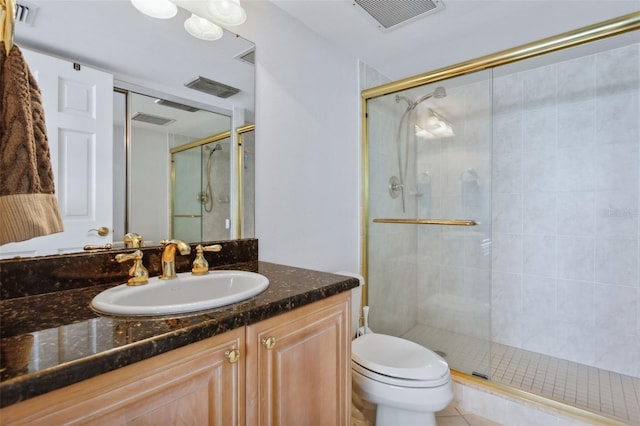 bathroom featuring vanity, toilet, and walk in shower