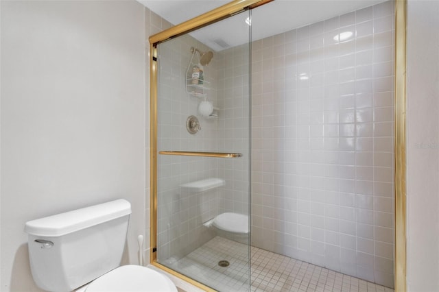 bathroom with toilet and walk in shower