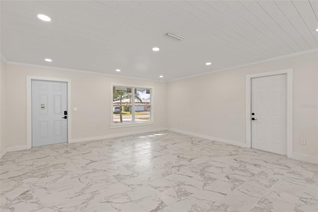 unfurnished room with crown molding