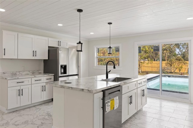 kitchen with stainless steel refrigerator with ice dispenser, sink, white cabinetry, decorative light fixtures, and a kitchen island with sink