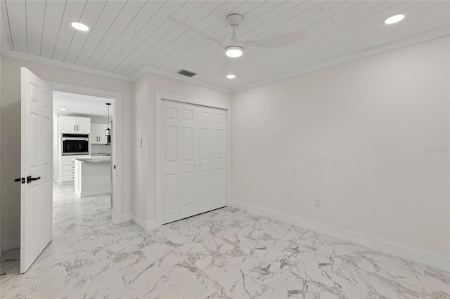 unfurnished bedroom featuring crown molding, wooden ceiling, a closet, and ceiling fan