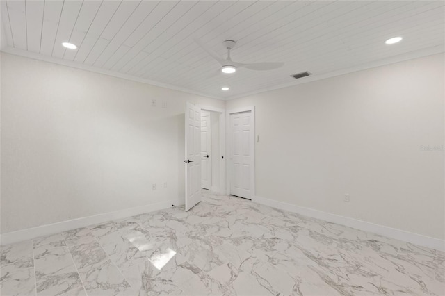 spare room featuring crown molding and ceiling fan