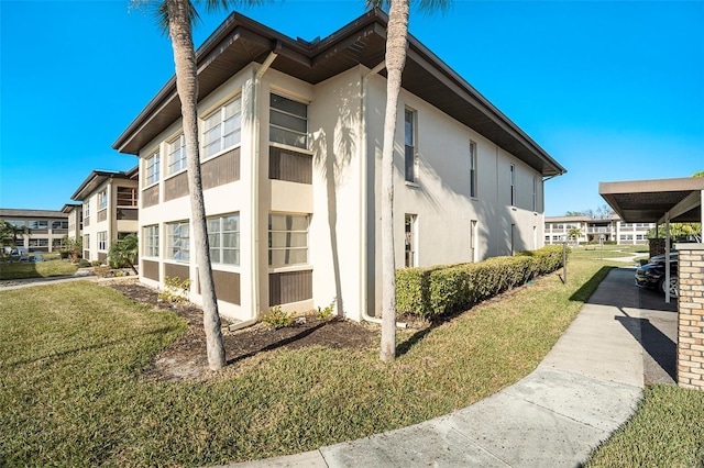 view of property exterior with a yard