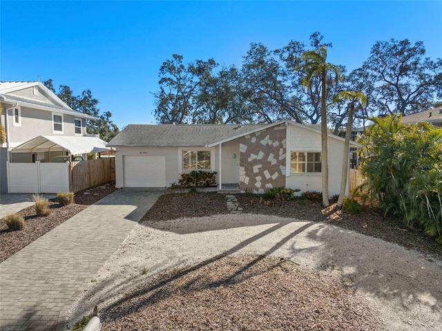 ranch-style home featuring a garage